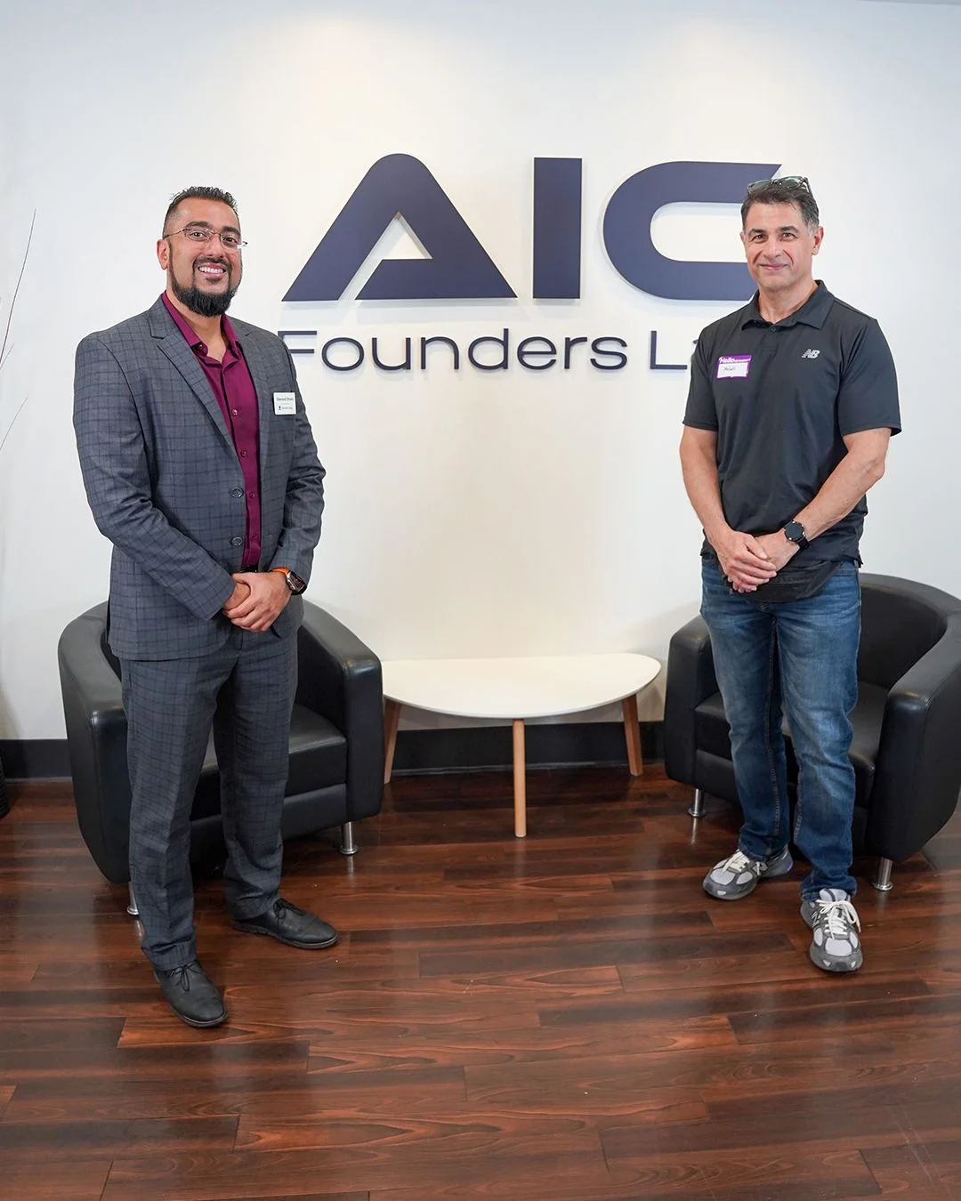 Two guests beside the Founders Lab sign — photo 8 of 20