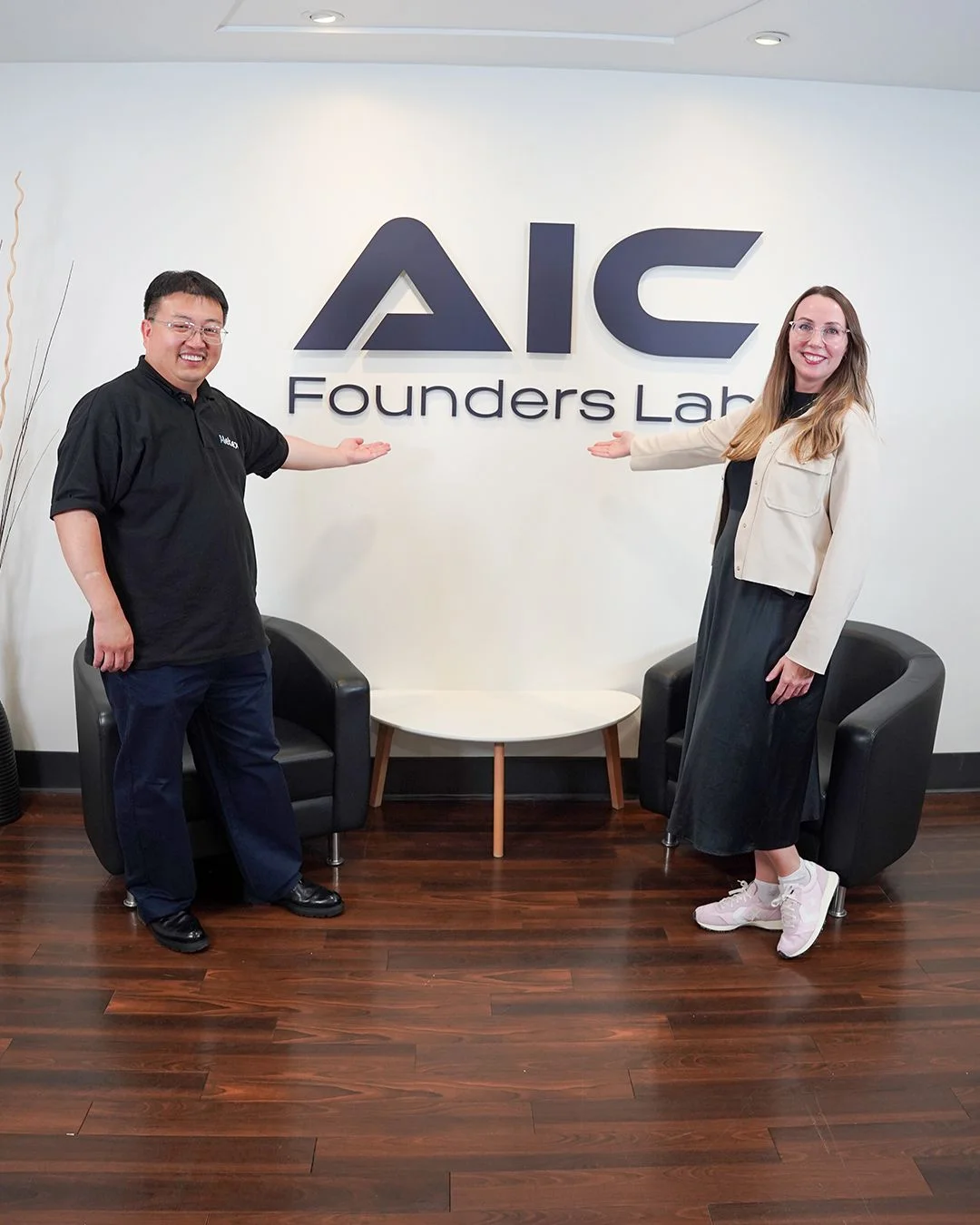 Two attendees beside the Founders Lab sign — photo 20 of 20